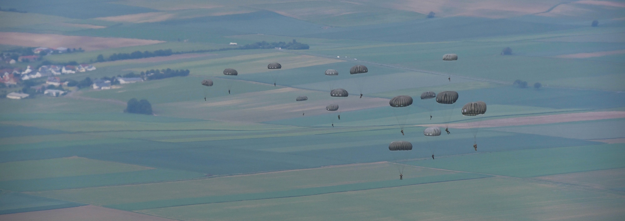 U.S. and allied paratroopers make their descent as one of their many jumps throughout International Jump Week 2018 near Ramstein Air Base, Germany, May 22, 2018. The annual event is hosted by the 435th Contingency Response Group and the 37th Airlift Squadron.