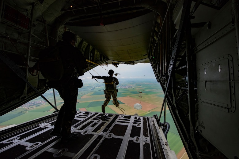 U.S. and allied paratroopers jump from a C-130J Super Hercules as part of International Jump Week 2018 near Ramstein Air Base, Germany, May 22, 2018. The purpose of the annual exercise is to strengthen international relations by working together to standardize techniques, tactics, and procedures for service members when dropping out of aircraft.