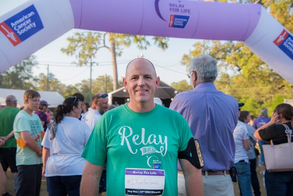 U.S. Navy Cmdr. Matthew Scott, 33rd Maintenance Squadron commander, stands near the Relay for Life starting line May 11, 2018, at Mullet Festival Fairgrounds in Niceville, Fla. Scott is running for his late sister-in-law, Grace, who passed away from breast cancer in March. (U.S. Air Force photo by Airman 1st Class Emily Smallwood)