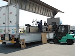 DLA Disposition Services personnel at Iwakuni, Japan, receive excess property from the old Marine Corps Air Station Iwakuni Branch Health Clinic to aid in the transition to the new Robert M. Casey Medical and Dental Clinic.