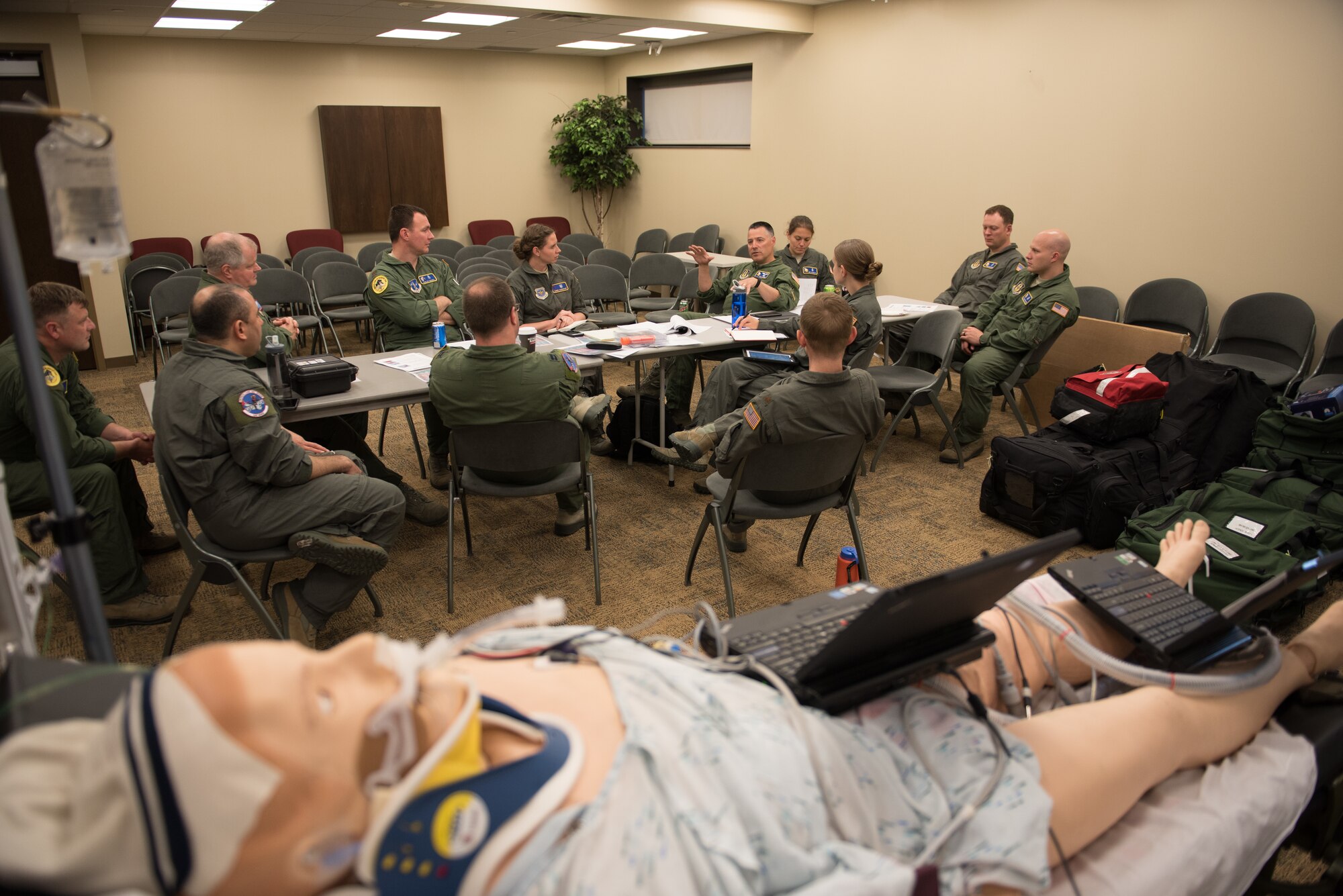 Lt. Col. Jeffrey Young, Chief of Medical Readiness for the 934th Airlift Wing Critical Care Air Transport Team, discusses clinical practice guidelines during CCATT training at the Minneapolis-St. Paul Air Reserve Station, Minn., May 29, 2018. Participating Guard members from Utah and New York will conduct simulated training mimicing real-world conditions found in forward deployment locations. (U. S. Air Force photo by Master Sgt. Eric Amidon)