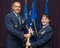 Brig. Gen. Alice W. Treviño accepts the Air Force Installation Contracting Agency flag from Maj. Gen. Bradley D. Spacy, Air Force Installation and Mission Support Center commander, as she becomes the AFICA commander May 23, 2018, during a change of command ceremony in the Wright-Patterson Air Force Base, Ohio, Club.
