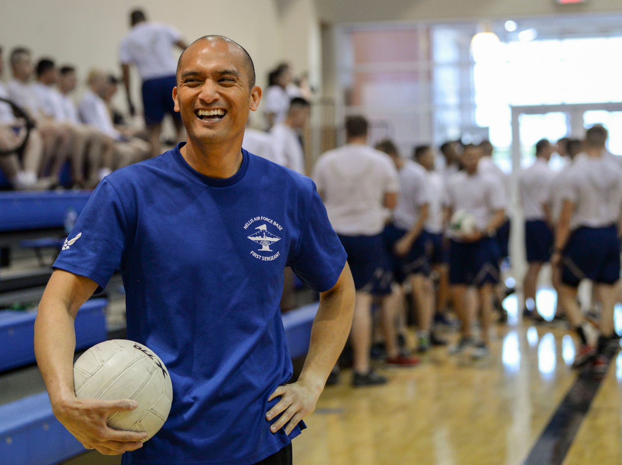 Master Sgt. Jonathan Baysa, 57th Operations Group first sergeant, takes part in a volleyball game with Airmen graduating from the Airmen Leadership School at the Warrior Fitness Center on Nellis Air Force Base, Nevada, May 9, 2018. The volleyball game is one of many activities first shirts engage in to boost morale. (U.S. Air Force photo by Airman Bailee A. Darbasie)