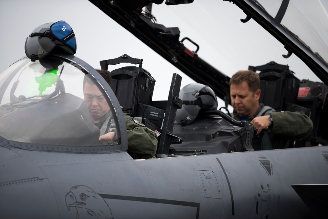 Col. Donn Yates, 48th Operations Group commander, and his weapon systems officer, run through their pre-flight systems checks for his final flight at Royal Air Force Lakenheath, England, June 1. Yates is expected to take command of the 4th Fighter Wing at Seymour Johnson Air Force Base, North Carolina this summer. (U.S. Air Force photo/Senior Airman Malcolm Mayfield)