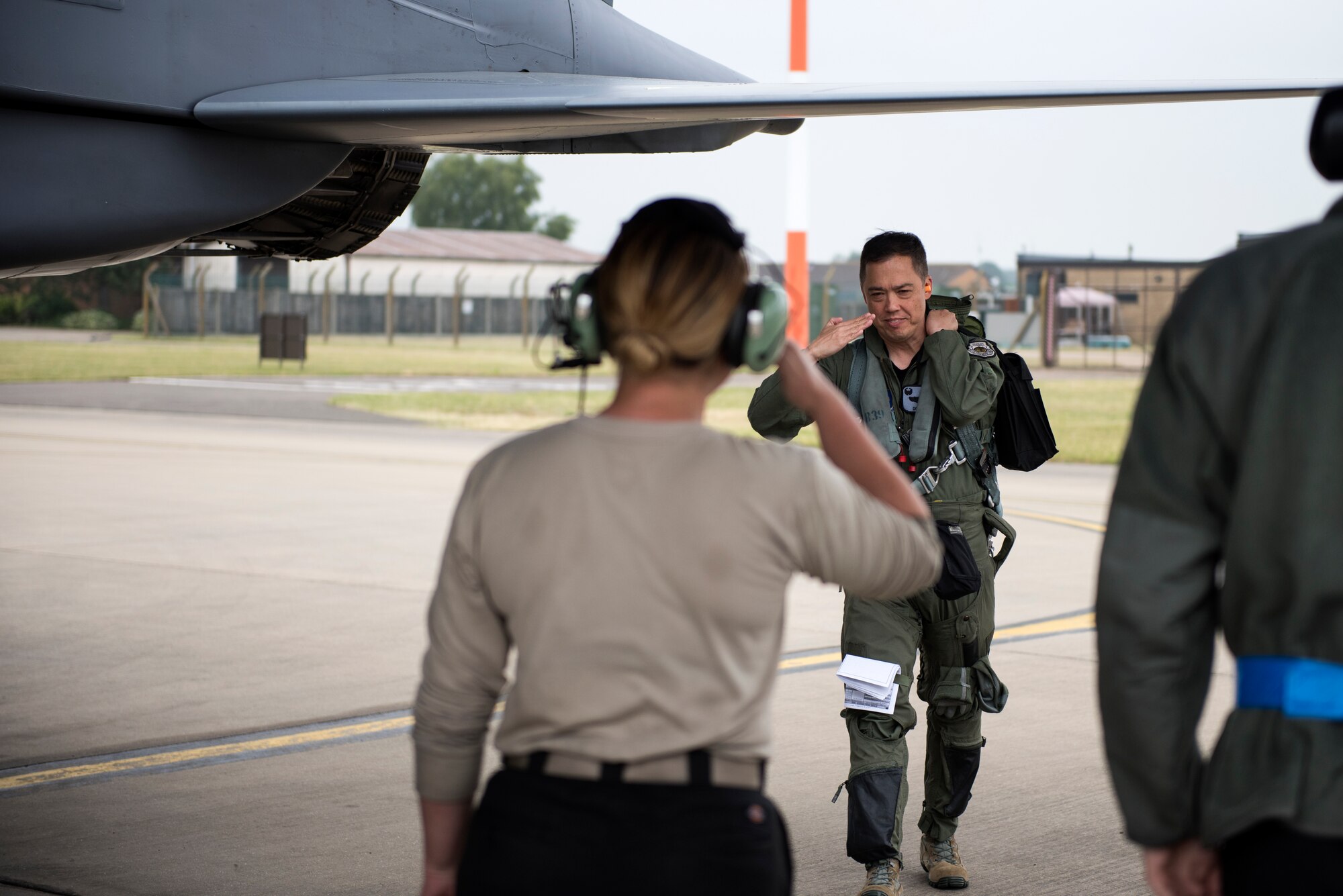 Col. Donn Yates, 48th Operations Group commander, returns a salute from a 48th Aircraft Maintenance Squadron Airman prior to his final flight at Royal Air Force Lakenheath, England, June 1. Yates is expected to take command of the 4th Fighter Wing at Seymour Johnson Air Force Base, North Carolina this summer.