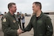 Col. Evan Pettus, 48th Fighter Wing commander, congratulates Col. Donn Yates, 48th Operations Group commander, upon completion of his final flight at Royal Air Force Lakenheath, England, June 1. Yates is expected to take command of the 4th Fighter Wing at Seymour Johnson Air Force Base, North Carolina this summer. (U.S. Air Force photo/Senior Airman Malcolm Mayfield)
