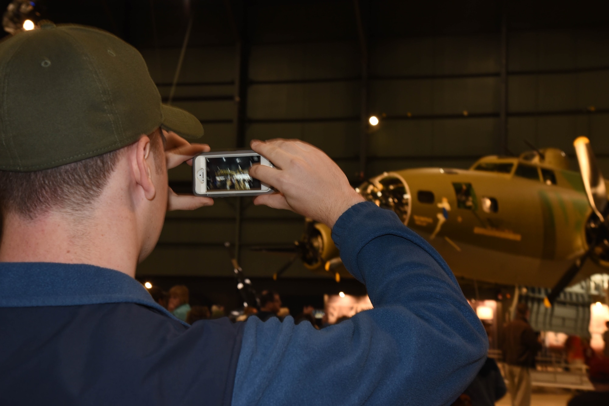 A museum visitor takes a picture of the B-17F Memphis Belle during the Memphis Belle exhibit opening events May 17-19, 2018. (U.S. Air Force photo by Ken LaRock)