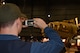 A museum visitor takes a picture of the B-17F Memphis Belle during the Memphis Belle exhibit opening events May 17-19, 2018. (U.S. Air Force photo by Ken LaRock)