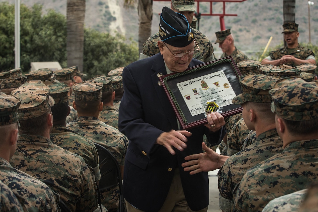 Retired U.S. Marine Corps Chief Warrant Officer 4 Hershel “Woody” Williams, the last surviving Medal of Honor recipient of the battle of Iwo Jima, shakes hands with Marines during his visit to the 5th Marine Regiment Vietnam War Memorial at Marine Corps Base Camp Pendleton, Calif., May 29, 2018.