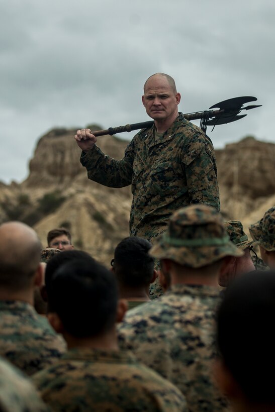 U.S. Marine Corps Lt. Col. Michael Nakonieczny, commanding officer of 1st Light Armored Reconnaissance Battalion, 1st Marine Division, holds the battalion's battle axe during Highlanders' Night at Marine Corps Base Camp Pendleton, Calif., May 24, 2018.