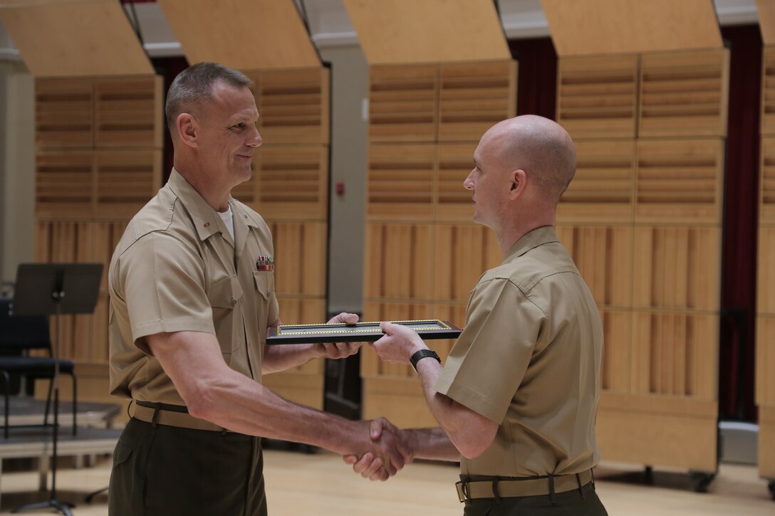 On June 1, 2018, Marine Band Director Col. Jason K. Fettig promoted newly-appointed Assistant Director Bryan Sherlock to the rank of captain in a ceremony in the John Philip Sousa Band Hall at the Marine Barracks Annex in Washington, D.C. (U.S. Marine Corps photo by Master Sgt. Kristin duBois/released)
