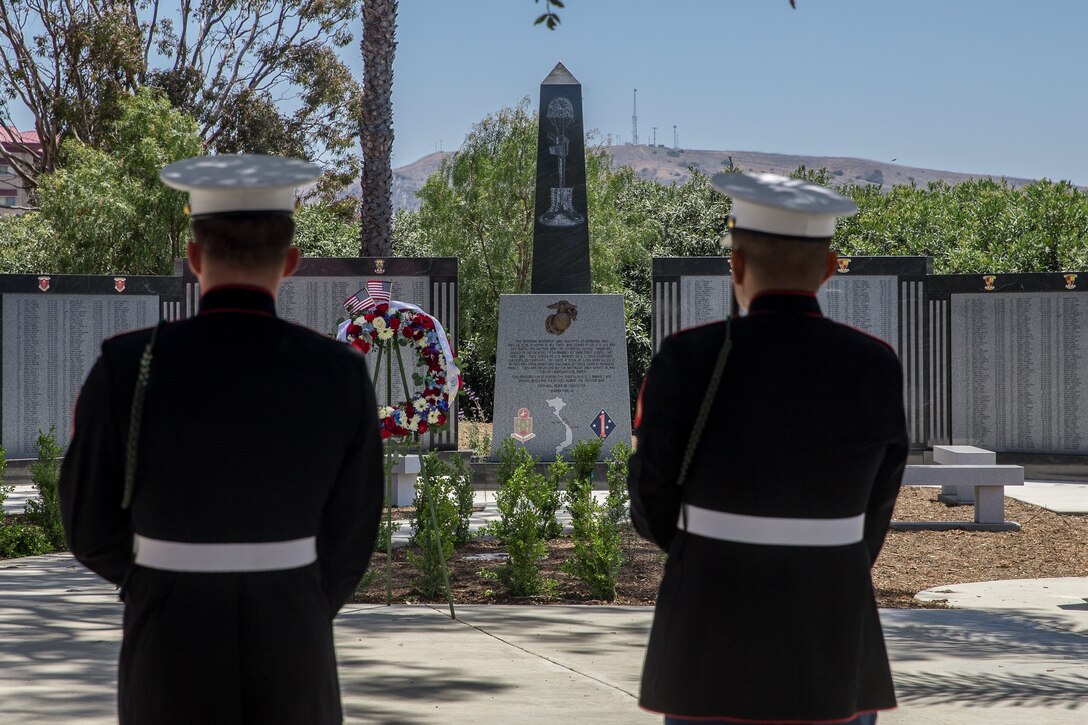 U.S. Marines with 5th Marine Regiment, 1st Marine Division, observe the 5th Marines Vietnam War Memorial unveiling ceremony in the Camp San Mateo Memorial Garden at Marine Corps Base Camp Pendleton, Calif., May 28, 2018.