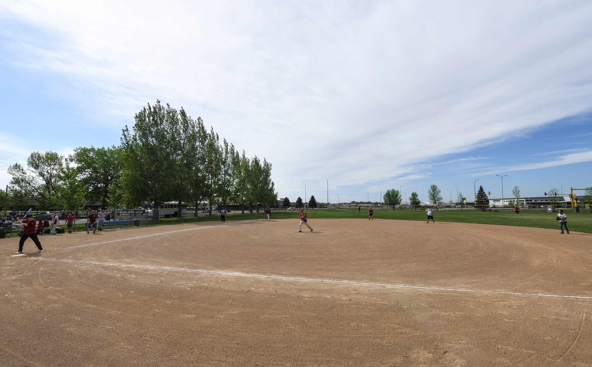 Team Minot faced-off against Team Grand Forks in the fourth annual Wingman Week softball tournament at Devils Lake, North Dakota, May 24, 2018.