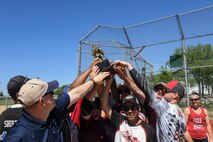 Team Minot faced-off against Team Grand Forks in the fourth annual Wingman Week softball tournament at Devils Lake, North Dakota, May 24, 2018.