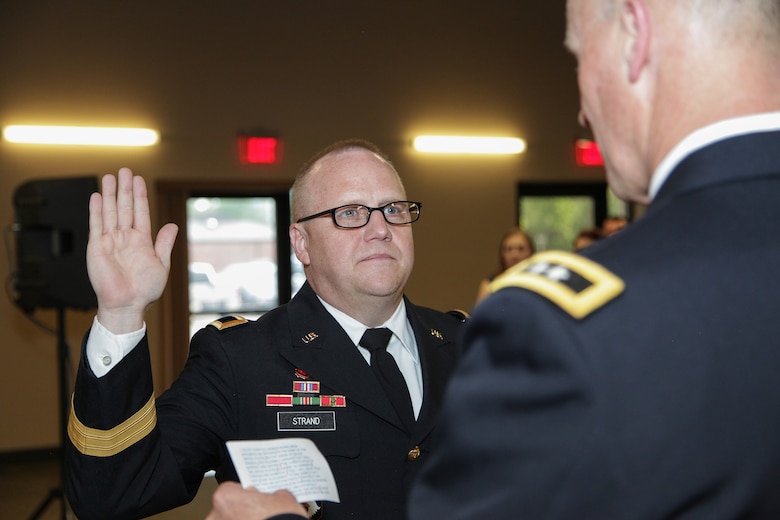 Newly promoted Maj. Gen. Stephan Strand (left), U.S. Army Corps of Engineers Deputy Commanding General for Reserve Affairs, recites the oath of office administered by Maj. General Michael Wehr, USACE Deputy Commanding General, Deputy Chief of Engineers, during a promotion ceremony at Redstone Arsenal, Alabama, May 31. Strand has served in the Army Reserve for more than 32 years and is responsible for the policies, procedures, and command guidance on issues concerning reserve component engineer resources.