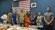 Service members and Department of Defense contractors pose for a photo at an Iftar dinner held to break the daily fast during Ramadan May 17, 2018, at Al Udeid Air Base, Qatar. Ramadan is one of the most celebrated observances for Muslims and is a time for increased worship. (U.S. Air Force photo by Staff Sgt. Enjoli Saunders)