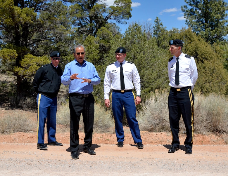 Col. Kirk Gibbs, Los Angeles District commander (far left); Lt. Col. James Booth, Albuquerque District commander (center); and Brig. Gen. Peter Helmlinger, South Pacific Division Commander, listen to Garrett Silversmith, director of the Navajo Nation Department of Transportation discuss the soil stabilization done on this road, April 23, 2018.