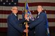 U.S. Air Force Col. Alex Ganster, 17th Training Group Commander, takes the 315th Training Squadron guideon from Lt. Col. Kenneth Stremmel, 315th TRS outgoing commander, at the 315th TRS Change of Command at the Louis F. Garland Department of Defense Fire Academy High Bay on Goodfellow Air Force Base, Texas, June 1, 2018. The guideon signifies the passing of command from one commander to the next. (U.S. Air Force photo by Staff Sgt. Joshua Edwards/Released)