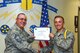 U.S. Air Force Chief Master Sgt. Daniel Stein, 17th Training Group superintendent, presents the 315th Training Squadron Student of the Month award to Airman 1st Class Vincent Angel, 315th TRS trainee, at Brandenburg Hall on Goodfellow Air Force Base, Texas, June 1, 2018. The 315th TRS’s vision is to develop combat-ready intelligence, surveillance and reconnaissance professionals and promote an innovative squadron culture and identity unmatched across the U.S. Air Force. (U.S. Air Force photo by Airman 1st Class Zachary Chapman/Released)