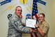 U.S. Air Force Chief Master Sgt. Daniel Stein, 17th Training Group superintendent, presents the 316th Training Squadron Student of the Month award to Pvt. Alyssa Fox, 316th TRS trainee, at Brandenburg Hall on Goodfellow Air Force Base, Texas, June 1, 2018. The 316th TRS’s mission is to conduct U.S. Air Force, U.S. Army, U.S. Marine Corps, U.S. Navy and U.S. Coast Guard cryptologic, human intelligence and military training. (U.S. Air Force photo by Airman 1st Class Zachary Chapman/Released)