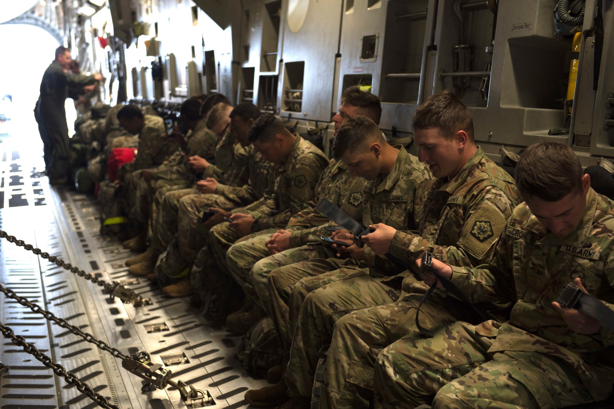 Army Soldiers from the 555th Engineer Brigade prepare to fly to Moses Lake, May 21, 2018, at Joint Base Lewis-McChord, Wash. The Soldiers were participating in a rapid deployment exercise. (U.S. Air Force photo by A1C Sara Hoerichs)