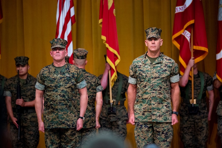 Brig. Gen. Daniel B. Conley, left, commanding general of 3rd Marine Logistics Group and Col. Ronald C. Braney, incoming commanding officer of 3rd MLG, stand at attention for the pass and review during a transfer of command ceremony June 1, 2018 at Camp Foster, Okinawa, Japan. Pass in review is a tradition in which the oncoming commanding officer inspects his troops before assuming command. Conley is a native of Falmouth, Massachusetts. Braney is a native of Manlius, New York. (U.S. Marine Corps photo by Cpl. Joshua Pinkney)