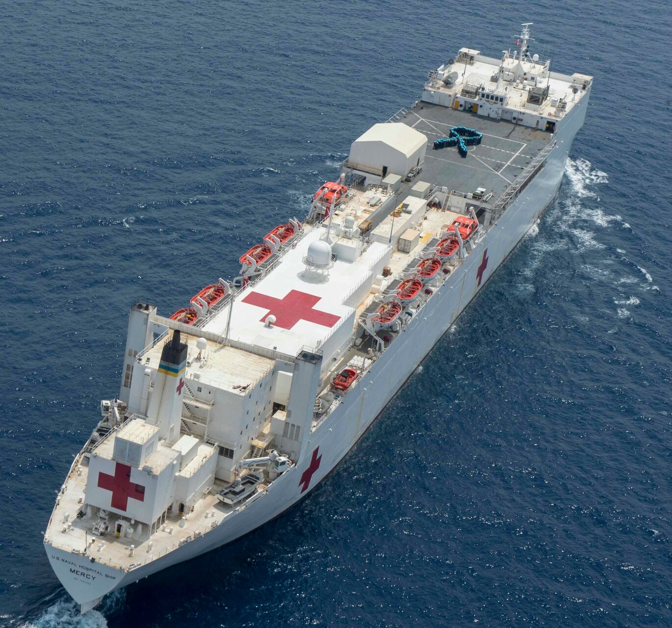 Joint Service Members aboard Military Sealift Command hospital ship USNS Mercy (T-AH 19) pose for a portrait on the flight deck in support of Sexual Assault Awareness and Prevention Month. Mercy is deployed in support of Pacific Partnership 2018 (PP18). PP18’s mission is to work collectively with host and partner nations to enhance regional interoperability and disaster response capabilities, increase stability and security in the region, and foster new and enduring friendships across the Indo-Pacific Region. Pacific Partnership, now in its 13th iteration, is the largest annual multinational humanitarian assistance and disaster relief preparedness mission conducted in the Indo-Pacific.