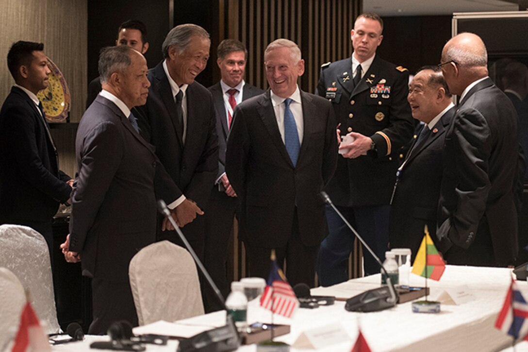 A group of men have a meeting.