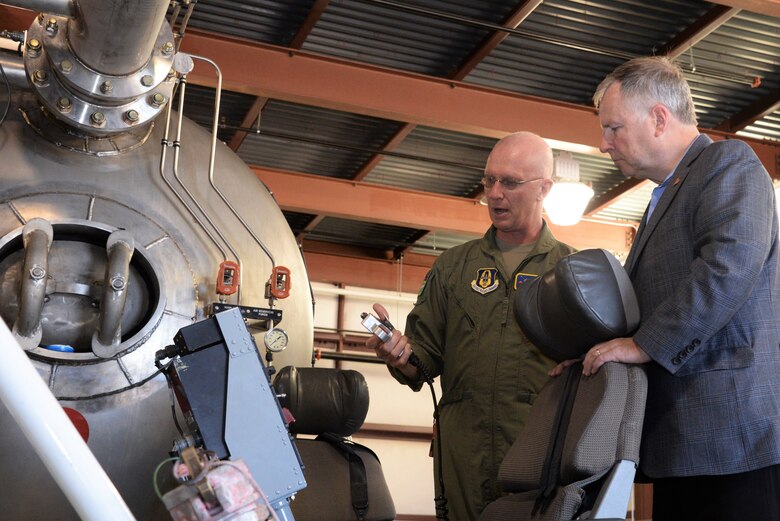 Master Sgt. Thomas Freeman, an Air Force Reserve Command loadmaster assigned to the 302nd Operations Group, explains how a U.S. Department of Agriculture Forest Service Modular Airborne Fire Fighting System works to U.S. Rep. Doug Lamborn at Peterson Air Force Base, Colorado, June 1, 2018. Lamborn came to the wing on an official visit to discuss the MAFFS mission with Col. James DeVere, the 302nd Airlift Wing commander. (U.S. Air Force photo/Staff Sgt. Frank Casciotta)