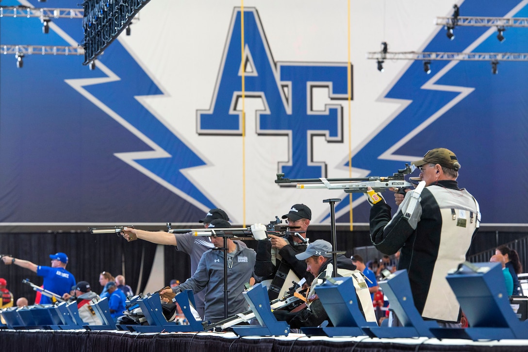 Warrior athletes train in air rifle practice.