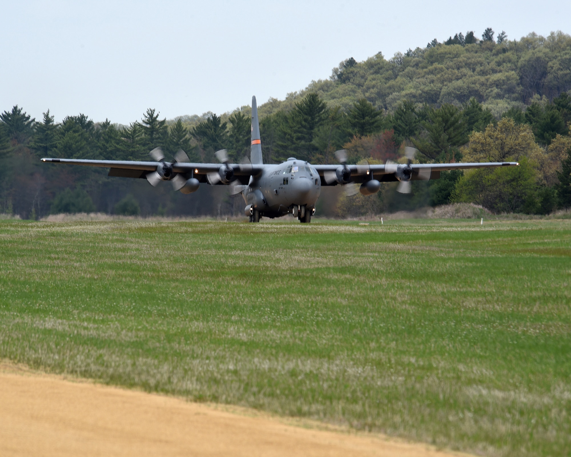 A C-130 Hercules from the 182nd Airlift Wing, Illinois Air National Guard, lands at Young Landing Zone at Fort McCoy, Wis. May 14, 2018. A number of pilots were qualifying to complete their unimproved landing certification. (U.S. Air National Guard photo by Master Sgt. Todd A. Pendleton)