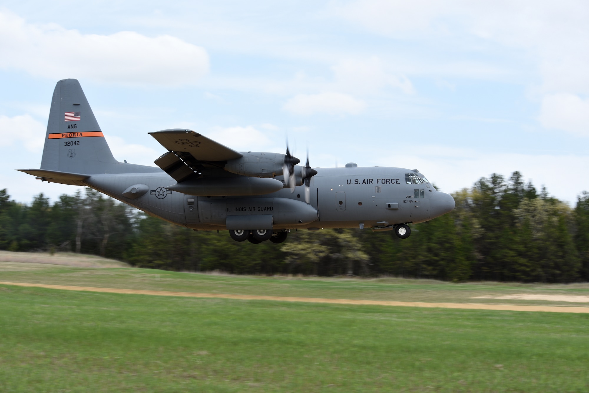 A C-130 Hercules from the 182nd Airlift Wing, Illinois Air National Guard, lands at Young Landing Zone at Fort McCoy, Wis. May 14, 2018. A number of pilots were qualifying to complete their unimproved landing certification. (U.S. Air National Guard photo by Master Sgt. Todd A. Pendleton)