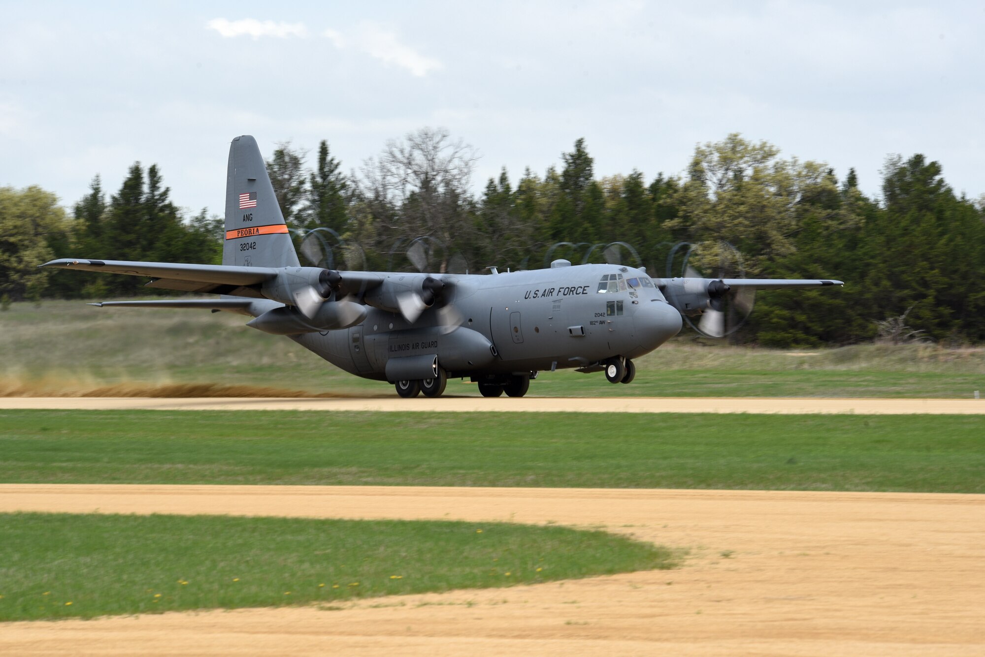 A C-130 Hercules from the 182nd Airlift Wing, Illinois Air National Guard, takes off from Young Landing Zone at Fort McCoy, Wis. May 14, 2018. A number of pilots were qualifying to complete their unimproved landing certification.  (U.S. Air National Guard photo by Master Sgt. Todd A. Pendleton)