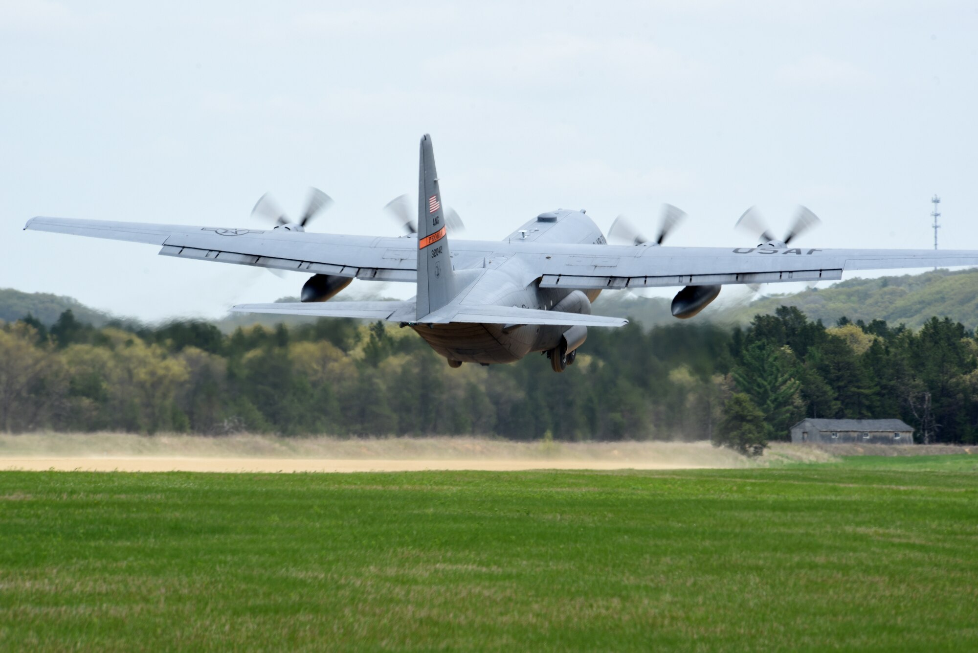 A C-130 Hercules from the 182nd Airlift Wing, Illinois Air National Guard, takes off from Young Landing Zone at Fort McCoy, Wis. May 14, 2018.  A number of pilots were qualifying to complete their unimproved landing certification. (U.S. Air National Guard photo by Master Sgt. Todd A. Pendleton)