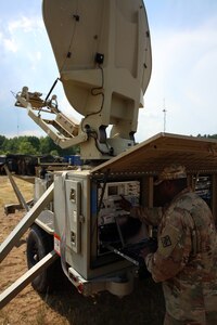 Soldier at satellite dish