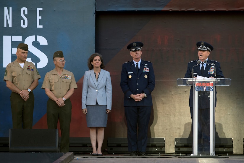 Air Force Chief of Staff Gen. David L. Goldfein speaks as deputy chairman of the Joint Chiefs of Staff Air Force Gen. Paul Selva stands by during opening ceremonies for the 2018 Warrior Games at the U.S. Air Force Academy in Colorado Springs, Colo., June 2, 2018. DoD photo by EJ Hersom