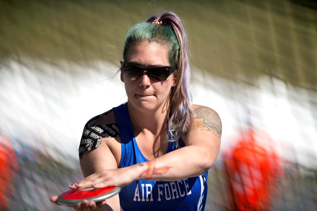 Medically retired Air Force Senior Airman Karah Behrend prepares to throw discus during the 2018 DoD Warrior Games at the U.S. Air Force Academy in Colorado Springs, Colo., June 2, 2018. The sisters met for the first time in person at the games. DoD photo by EJ Hersom