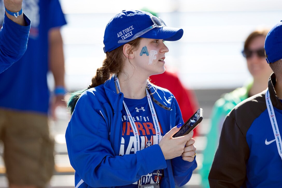 Crystal Boyd cheers on her sister during the 2018 DoD Warrior Games at the U.S. Air Force Academy in Colorado Springs, Colo., June 2, 2018. Boyd met her sister Karah Behrend, who is a medically retired Air Force veteran, for the first time at the games. DoD photo by EJ Hersom