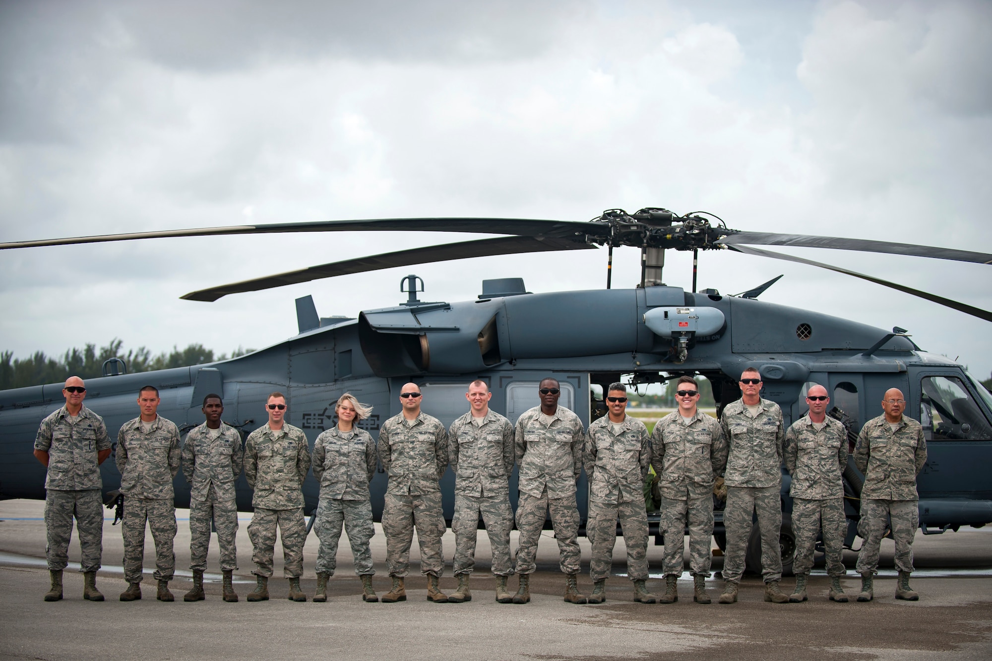 Air Force Reserve Citizen Airmen from the 920th Maintenance Squadron, out of Patrick Air Force Base in Cocoa Beach, Florida, smile in front of an HH-60G Pave Hawk helicopter, May 25th, 2018, at Miami, before a practice run for the 2nd annual Salute to American Heroes Air and Sea Show. This two-day event showcases military fighter jets and other aircraft and equipment from all branches of the United States military in observance of Memorial Day, honoring servicemembers who have made the ultimate sacrifice. (U.S. Air Force photo/Staff Sgt. Jared Trimarchi)