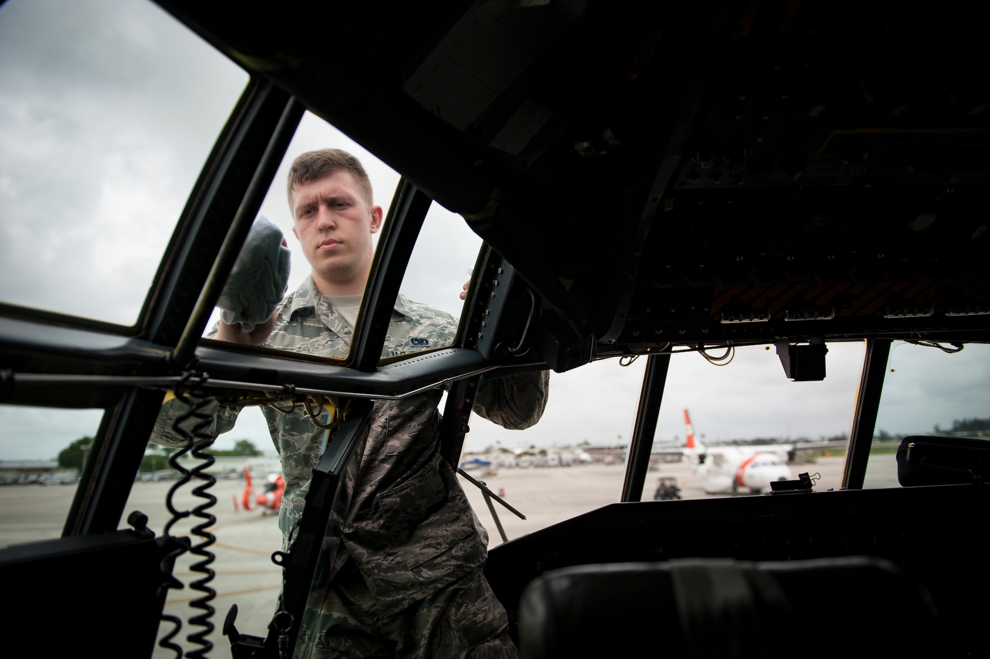 Air Force Reserve Senior Airman  Spencer Kalapp, crew chief, 720th Aircraft Maintenance Squadron from Patrick Air Force Base in Cocoa Beach, Florida, cleans the windshields of an HC-130- P/N “King” on May 25th, 2018, at Miami, before a practice run for the 2nd annual Salute to American Heroes Air and Sea Show. This two-day event showcases military fighter jets and other aircraft and equipment from all branches of the United States military in observance of Memorial Day, honoring servicemembers who have made the ultimate sacrifice. (U.S. Air Force photo/Staff Sgt. Jared Trimarchi)
