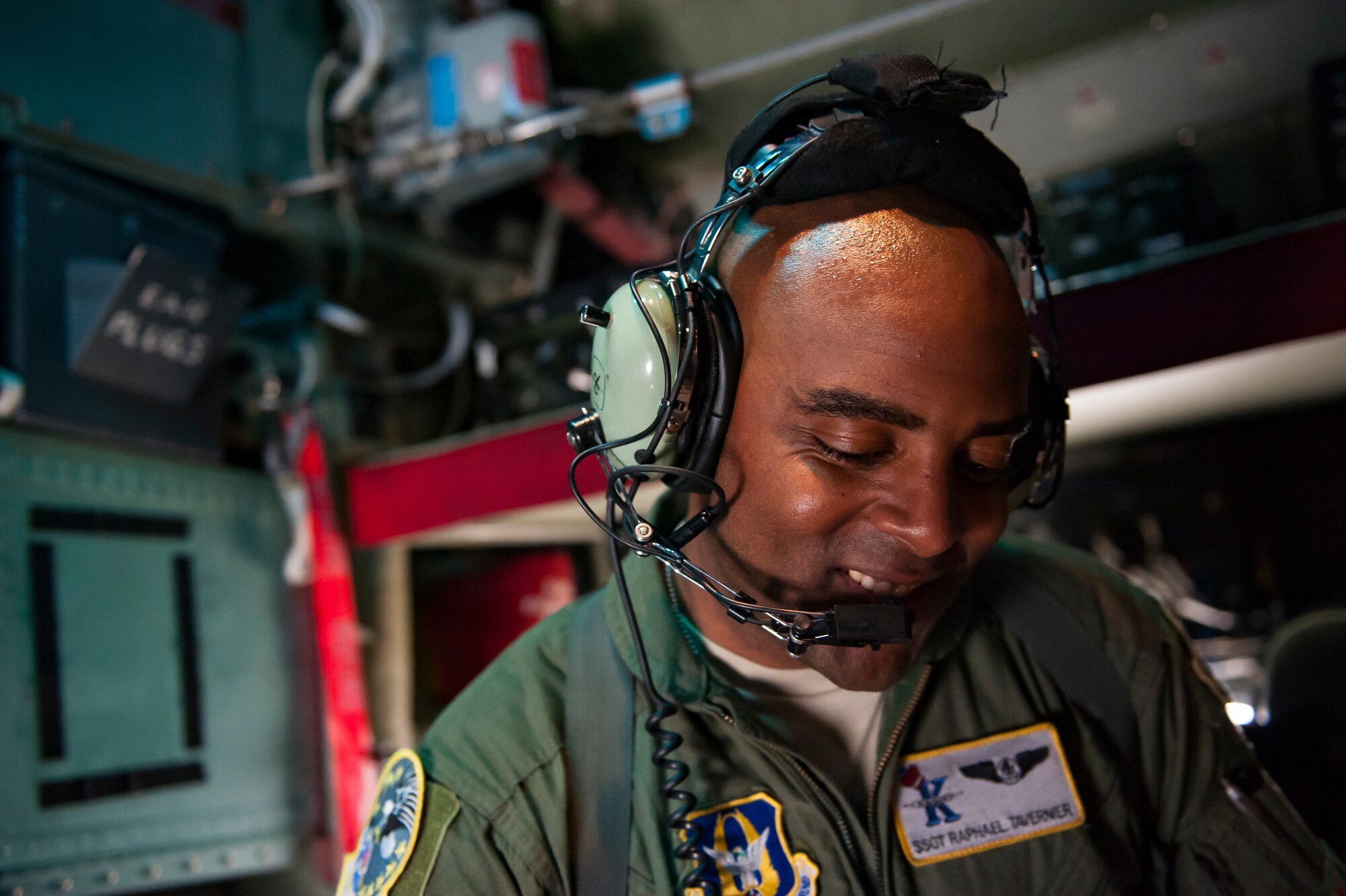 Air Force Reserve Staff Sergeant Raphael Tavernier, with the 39th Rescue Squadron out of Patrick Air Force Base in Cocoa Beach, Florida, communicates to the pilots of an HC-130- P/N “King” on May 25th, 2018, at Miami, before a practice run for the 2nd annual Salute to American Heroes Air and Sea Show. This two-day event showcases military fighter jets and other aircraft and equipment from all branches of the United States military in observance of Memorial Day, honoring servicemembers who have made the ultimate sacrifice. (U.S. Air Force photo/Staff Sgt. Jared Trimarchi)