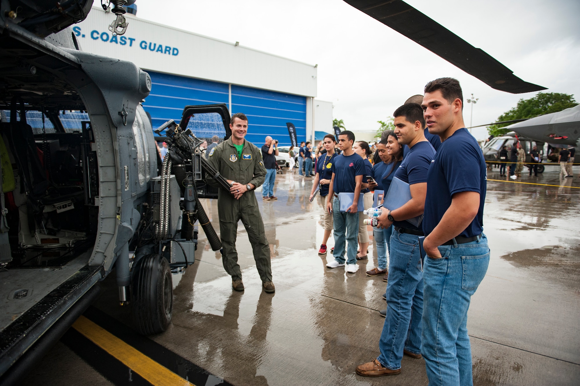 Air Force Reserve Citizen Airman 1st Lt. Andy Deck from the 301st Rescue Squadron out of Patrick Air Force Base in Cocoa Beach, Florida, talks to a group of future servicemembers, May 25th, 2018, at Miami, after a practice run for the 2nd annual Salute to American Heroes Air and Sea Show over Miami Beach, Florida. This two-day event showcases military fighter jets and other aircraft and equipment from all branches of the United States military in observance of Memorial Day, honoring servicemembers who have made the ultimate sacrifice. (U.S. Air Force photo/Staff Sgt. Jared Trimarchi)