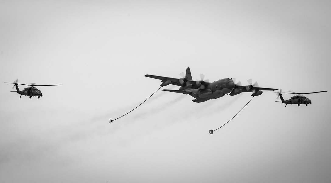 Air Force Reserve Citizen Airmen from the 920th Rescue Wing demonstrate an aerial refuling with an HC-130- P/N “King” aircraft and two HH-60G Pave Hawk helicopters at Miami Beach on May 26th, 2018, during the 2nd annual Salute to American Heroes Air and Sea Show. This two-day event showcases military fighter jets and other aircraft and equipment from all branches of the United States military in observance of Memorial Day, honoring servicemembers who have made the ultimate sacrifice. (U.S. Air Force photo/Staff Sgt. Jared Trimarchi)