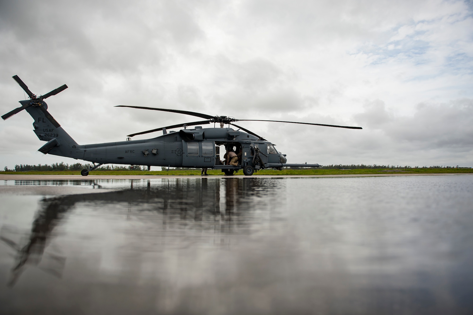 U.S. Air Force assigned to the the 920th Rescue Wing, Air Force Reserve, out of Patrick Air Force Base in Cocoa Beach, Florida, prepare an HH-60G Pave Hawk helicopter for flight May 27, 2018 during the 2nd annual Salute to American Heroes Air and Sea Show in Miami. This two-day event showcases military fighter jets and other aircraft and equipment from all branches of the United States military in observance of Memorial Day, honoring servicemembers who have made the ultimate sacrifice. (U.S. Air Force photo by Staff Sgt. Jared Trimarchi)