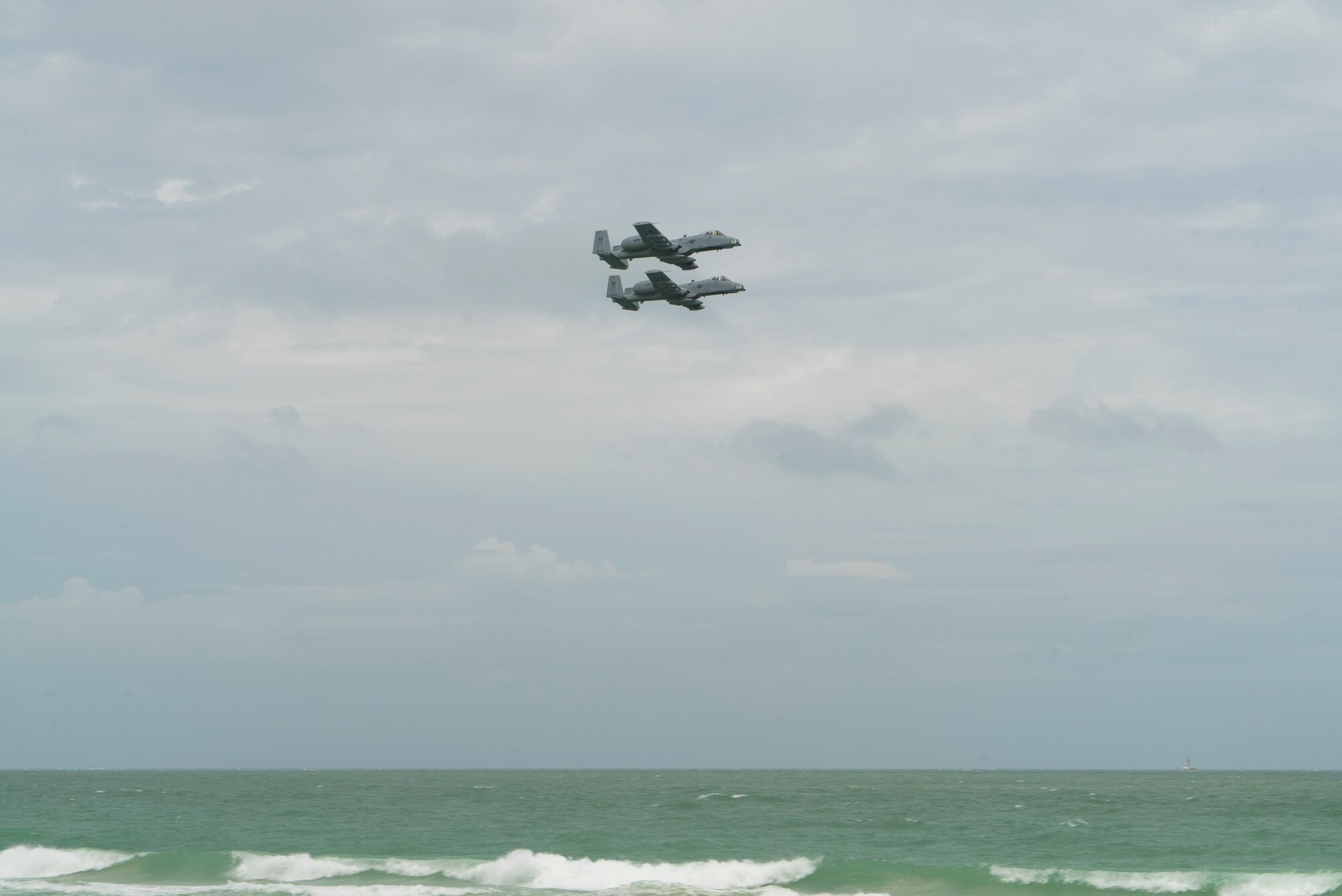 Two A-10 Thunderbolt IIs from the 442nd Fighter Wing fly in formation as part of a combat search and rescue demonstration with the 920th Rescue Wing over Miami Beach, Florida on May 26th, 2018 during the 2nd annual Salute to American Heroes Air and Sea Show. This two-day event showcases military fighter jets and other aircraft and equipment from all branches of the United States military in observance of Memorial Day. (U.S. Air Force Reserve video by Staff Sergeant Nicholas A. Priest)