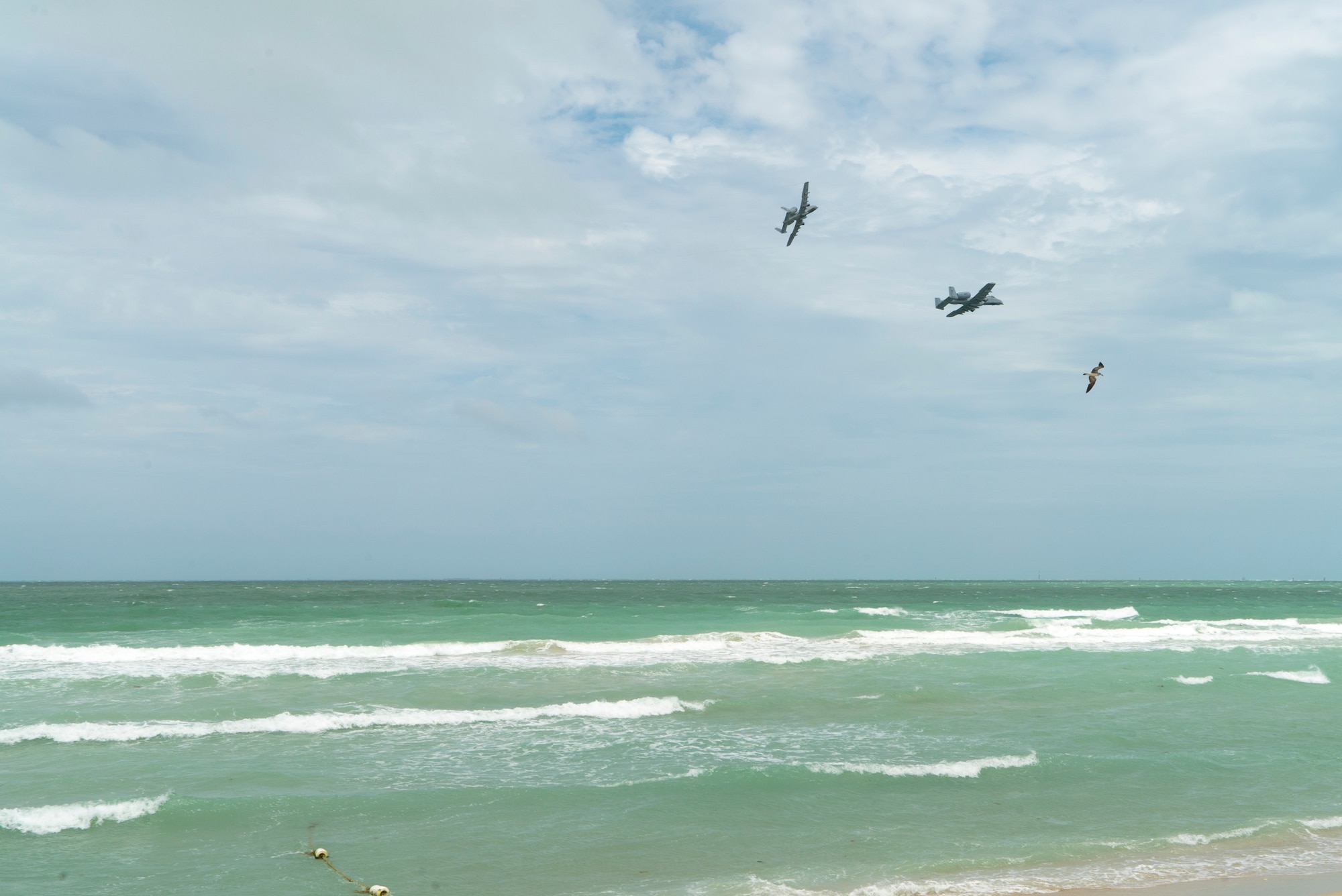 Two A-10 Thunderbolt IIs from the 442nd Fighter Wing fly in formation as part of a combat search and rescue demonstration with the 920th Rescue Wing over Miami Beach, Florida on May 26th, 2018 during the 2nd annual Salute to American Heroes Air and Sea Show. This two-day event showcases military fighter jets and other aircraft and equipment from all branches of the United States military in observance of Memorial Day. (U.S. Air Force Reserve video by Staff Sergeant Nicholas A. Priest)