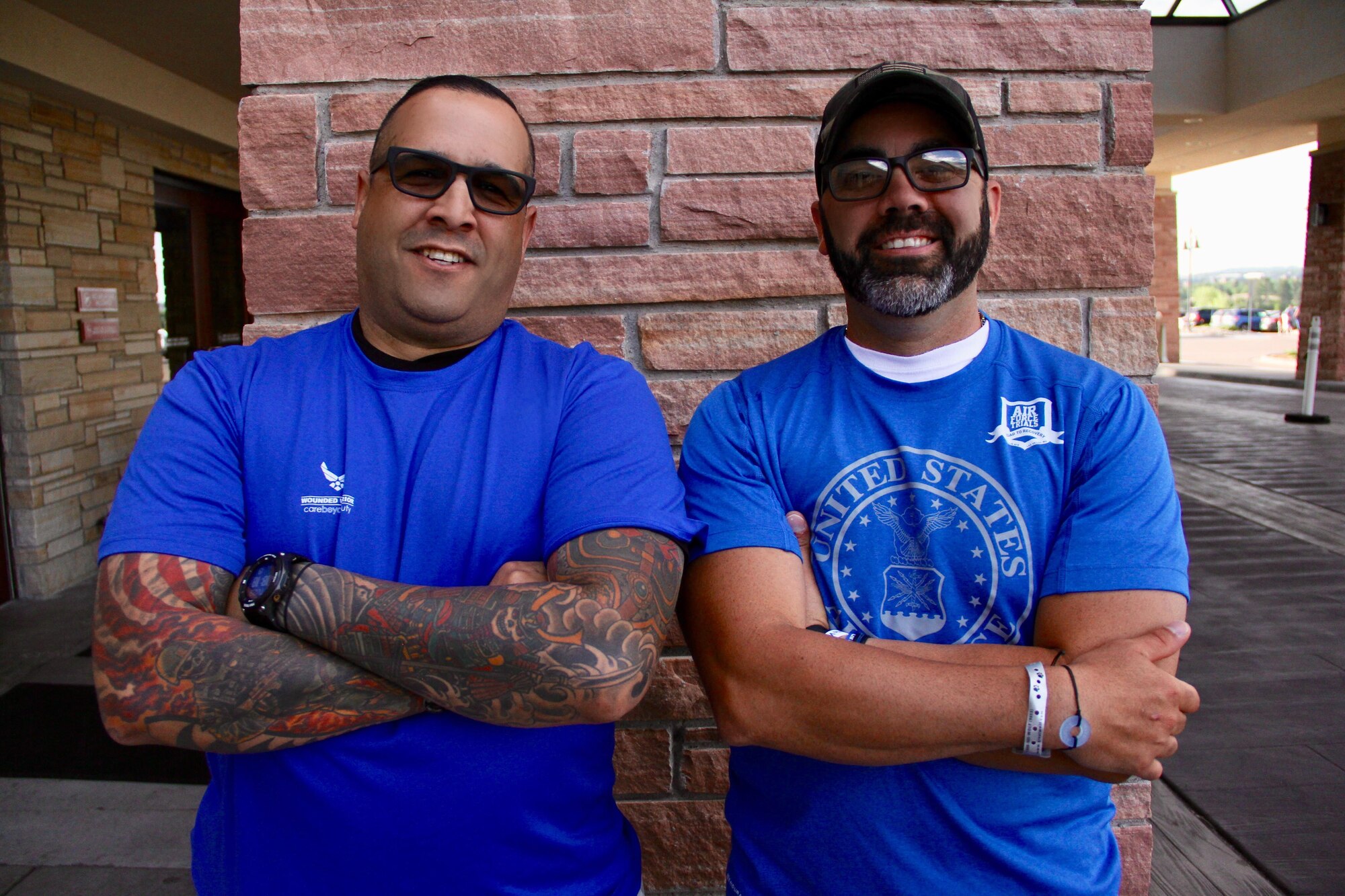 U.S. Air Force Master Sgt. Jose Rijos (left), 104th Fighter Wing Security Forces, stands with Master Sgt. Andres Rodriguez (right), 132nd Medical Group bioenvironmental engineer, May 29, 2018, in Colorado Springs, Colo. Rijos is here as a caregiver for Rodriguez, who is one of the 39 athletes representing Team Air Force during the 2018 Warrior Games. (U.S. Air Force photo by Jay Martinez)