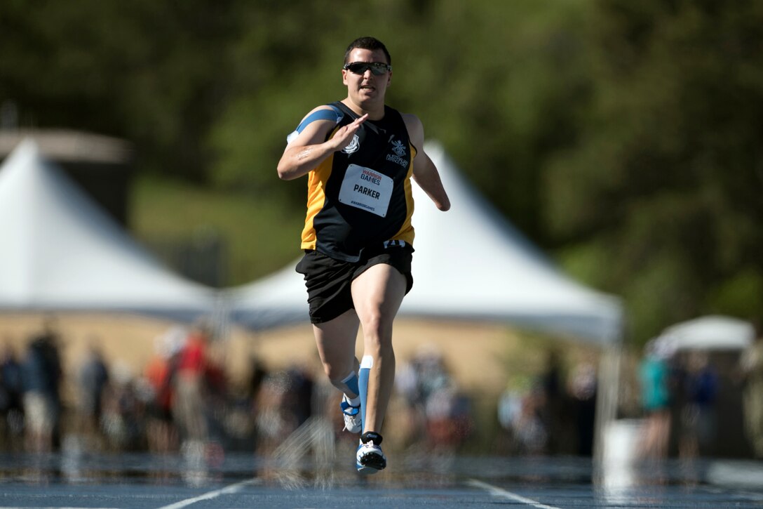 A service member from Team Australia runs the 100-meter dash during the 2018 Defense Department Warrior Games.