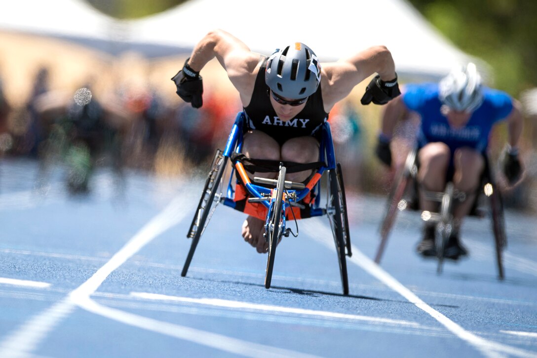 A service member competes in the wheelchair competition.