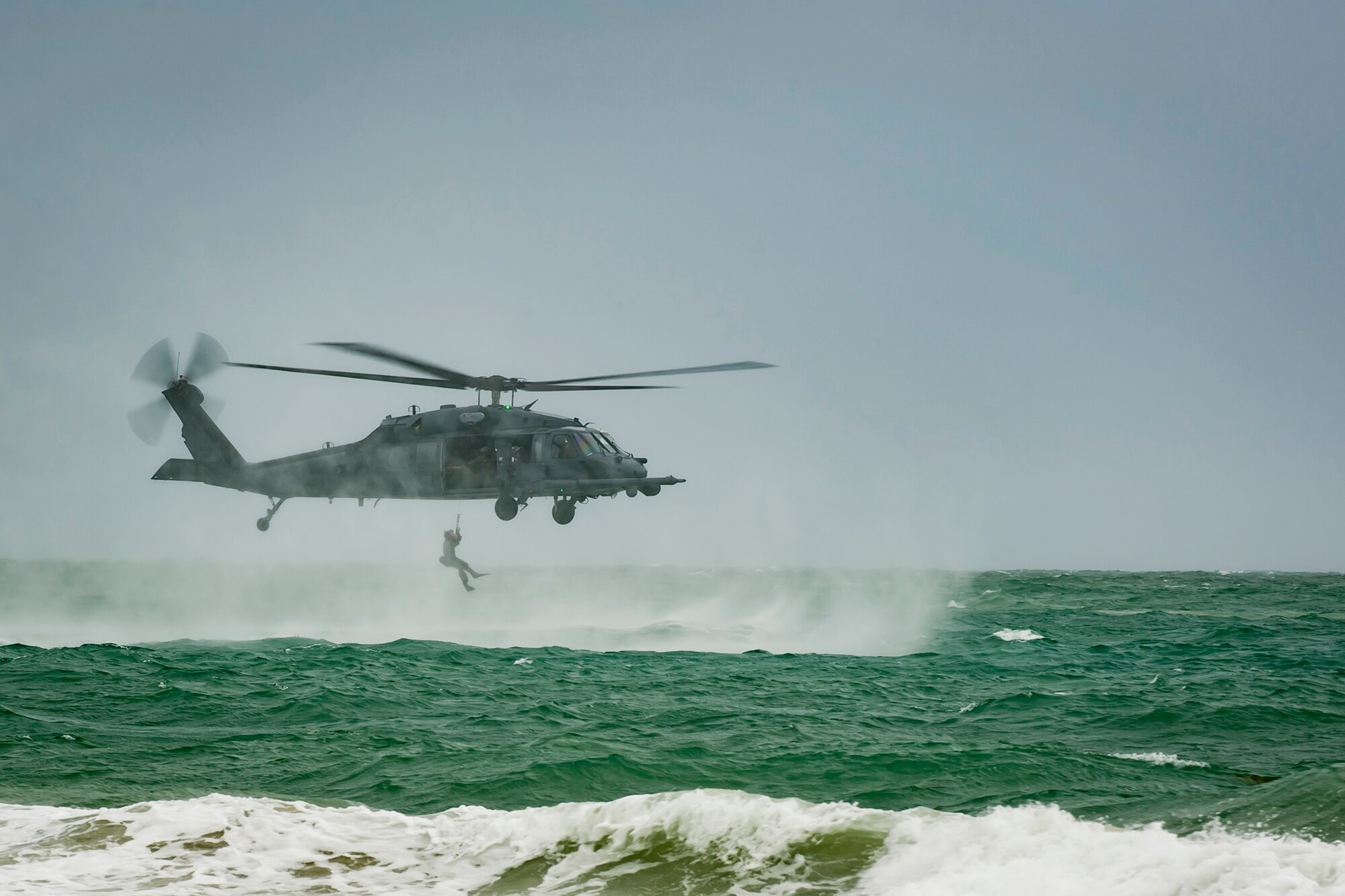 A U.S. Air Force Reserve pararescueman assigned to the 920th Rescue Wing is hoisted aboard an HH-60G Pave Hawk helicopter on May 26th, 2018, during the 2nd Annual Salute to American Heroes Air and Sea Show, in Miami Beach, Florida. This two-day event showcases military fighter jets and other aircraft and equipment from all branches of the United States military in observance of Memorial Day, honoring servicemembers who have made the ultimate sacrifice. (U.S. Air Force photo by Staff Sgt. Jared Trimarchi)